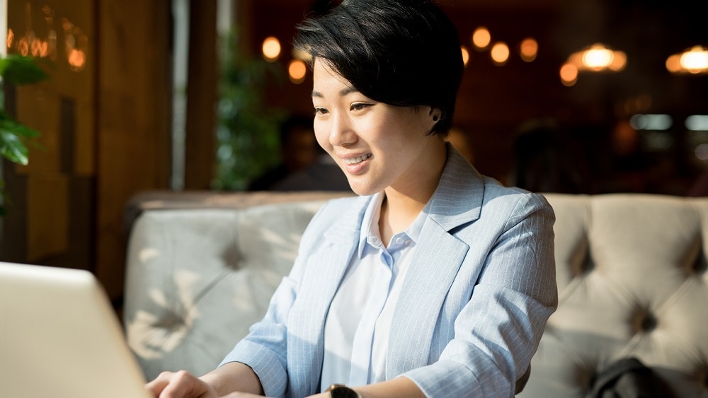 Person working on laptop in casual setting