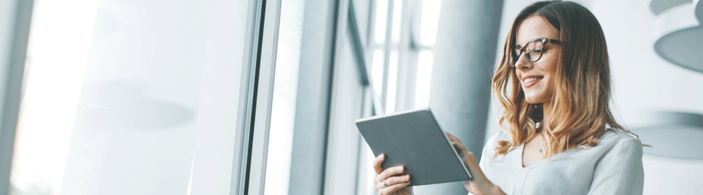 Lady in office looking at ipad