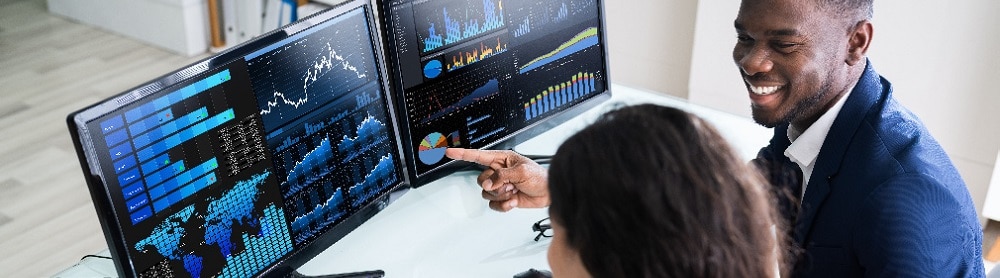 professionals analyzing data on a screen