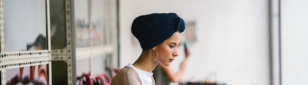 Person working on laptop in coffee shop