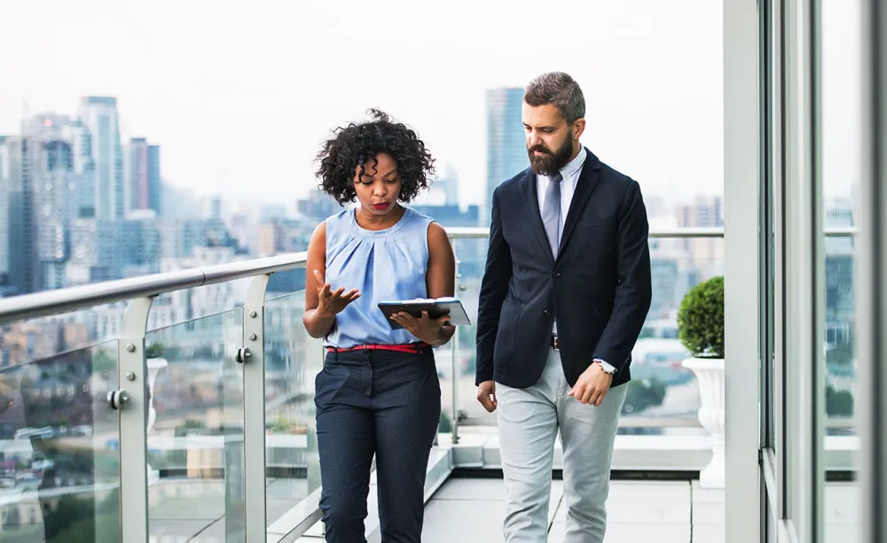 Two consultants walking and talking