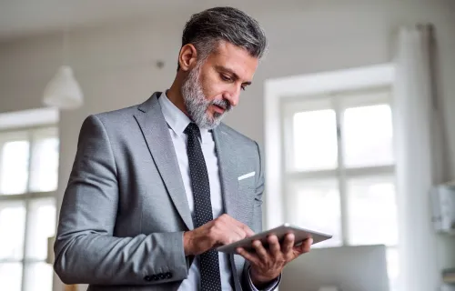 Executive working on a table while standing