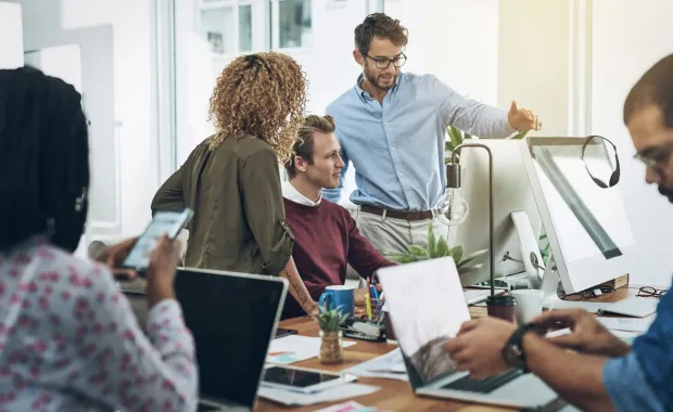 Colleagues discussing application modernization