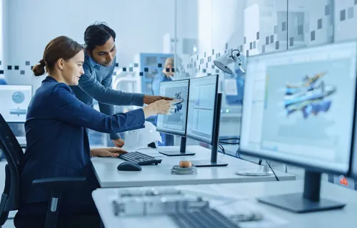 consultants pointing to onscreen data