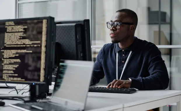 Engineer working on a desktop computer