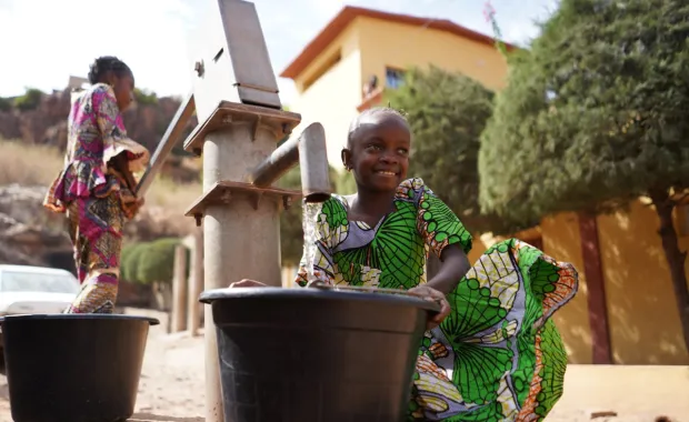 African Girls Fetching Water at the Borehole