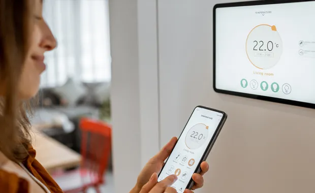 person viewing smart meter information on mobile device