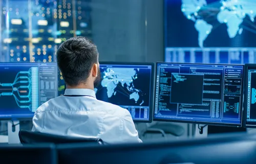 man monitors satellite data